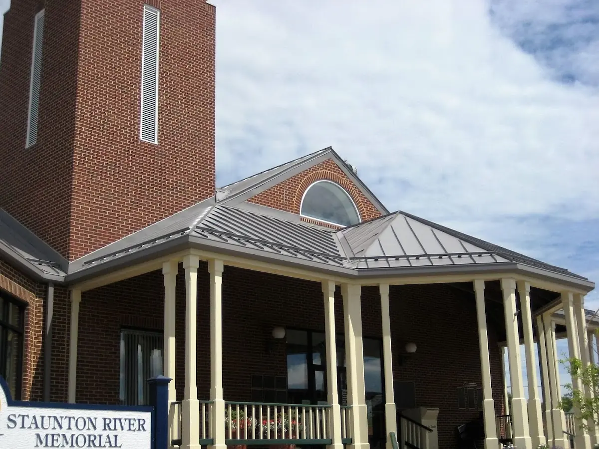 Skilled roofing craftsmen working on a residential roof in Galax